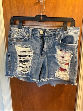Distressed Blue Denim Cutoff Shorts with Flag Underlay